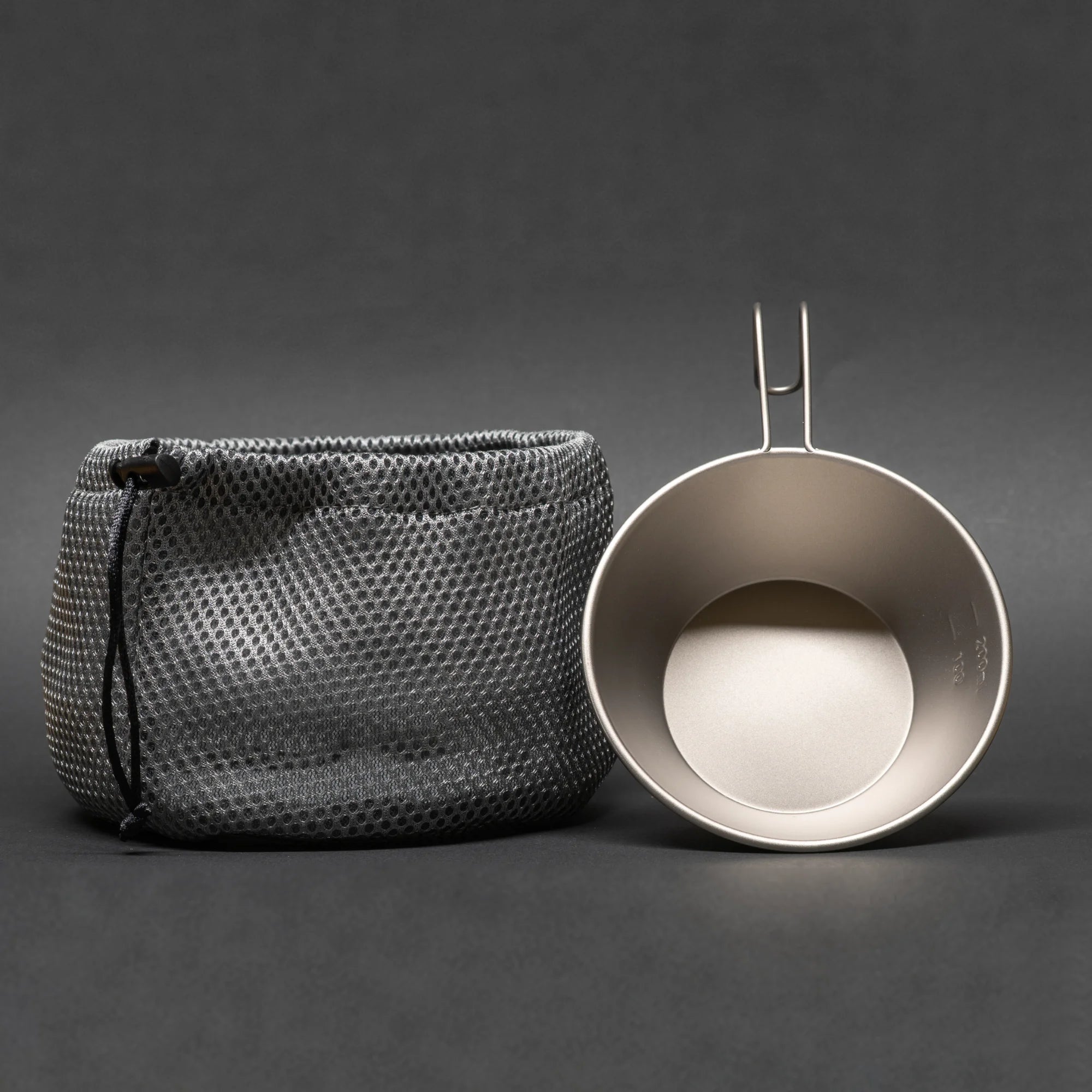 TriCamp Titanium Sierra Cup in use — boiling water outdoors on camping stove